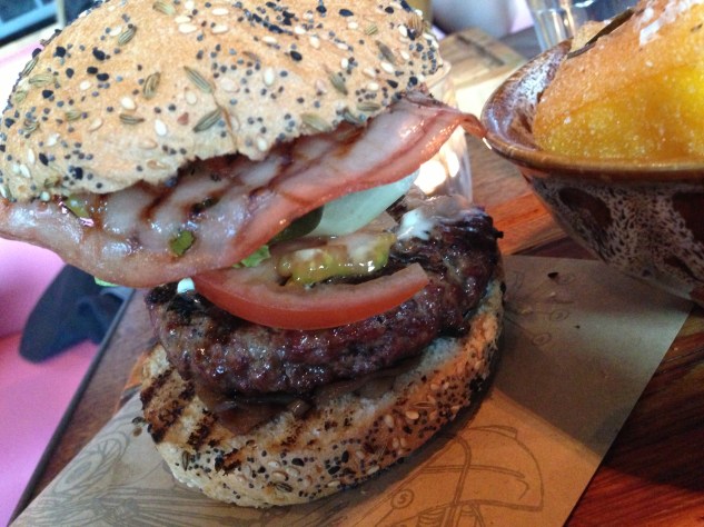 The burger was stacked with toppings