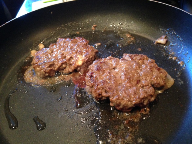 Cooking the patties.