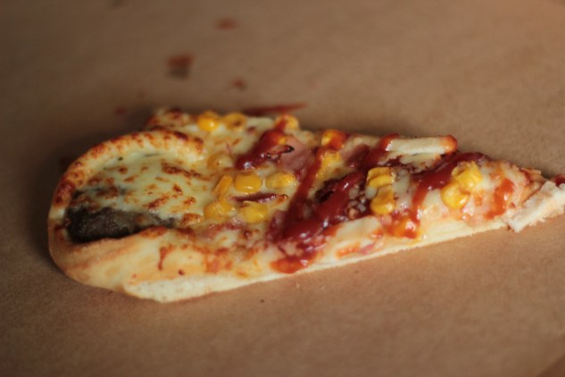 A slice of the pizza on its own.