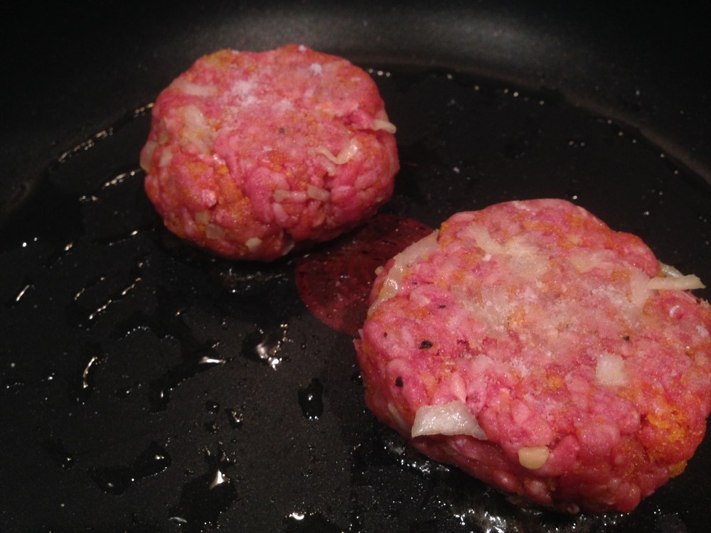 Cooking the patties.