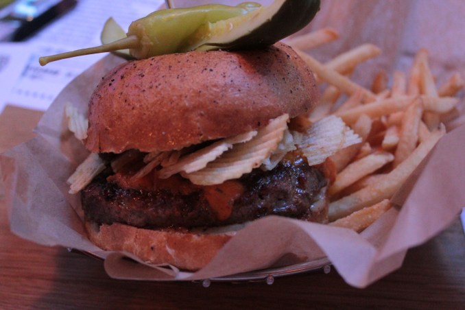 Topped with crisps....err, potato chips, bacon jam & cheese